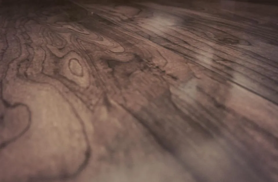 Close up angle of a dark walnut wood floor